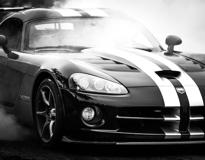 Luxury Cars - Monochrome image of a luxury sports car emitting #12969801