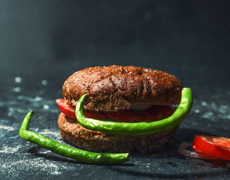 Food Aesthetics - Rustic bun with tomatoes and green peppers on da #13624263