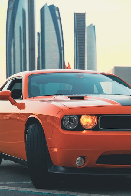 Luxury Cars - Dynamic shot of an orange sports car with Dubai #13916693
