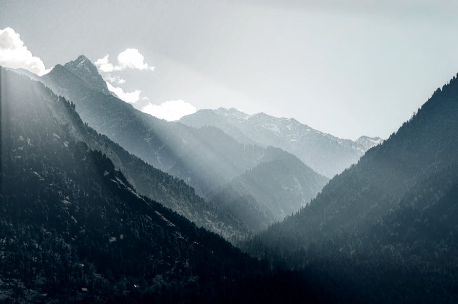 Mountain Landscapes - Breathtaking view of sunrays piercing through th #14265677