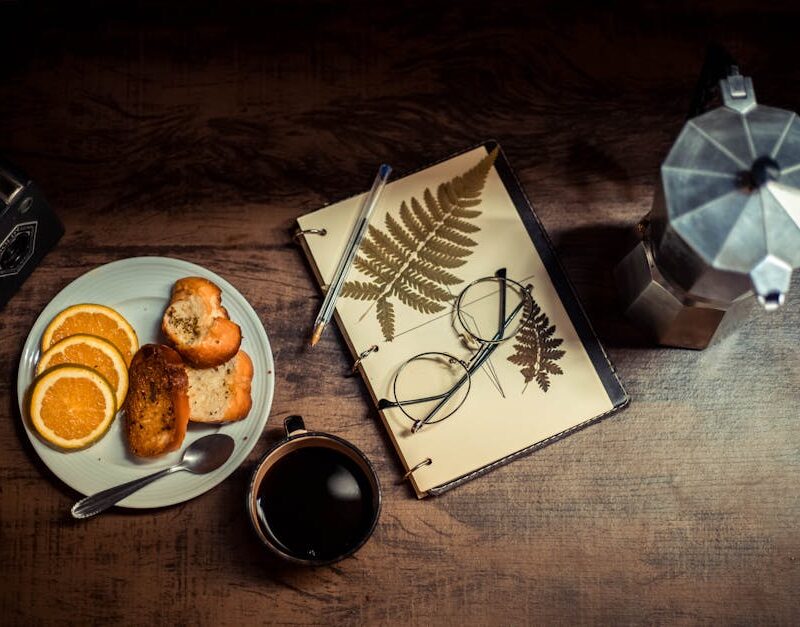 Food Aesthetics - A warm breakfast setup with coffee, orange slice #14792337