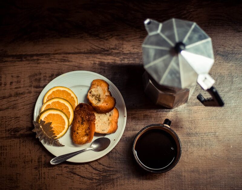 Food Aesthetics - Warm breakfast scene with coffee, toast, and ora #14792353