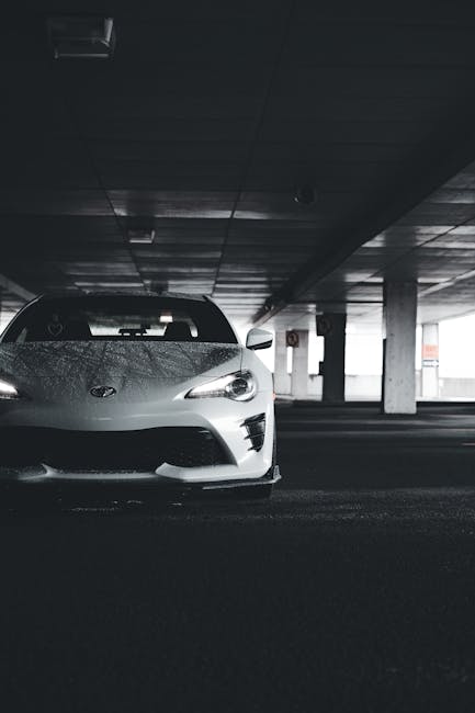 Luxury Cars - White sports car showcased in a dimly lit urban #17793011