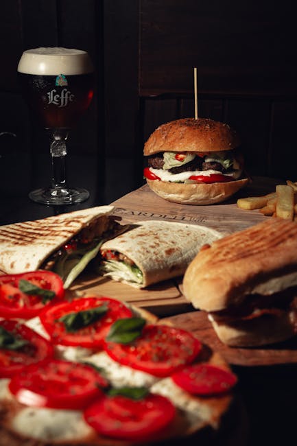 Food Aesthetics - Gourmet burger with beer and assorted sandwiches #24554389