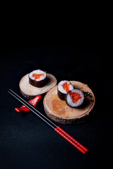 Food Aesthetics - Sushi rolls served on wooden slices with red cho #31286809
