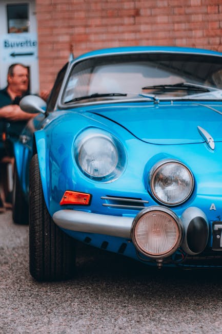 Luxury Cars - A classic blue sports car with a striking front #33285093