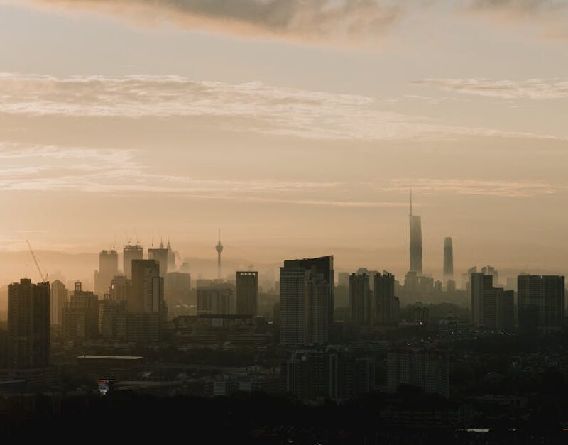 City Architecture - Silhouette of Kuala Lumpur skyline during sunris #33374886