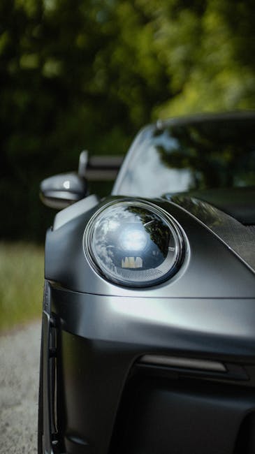 Luxury Cars - Close-up of a sleek sports car headlight in a fo #34285247