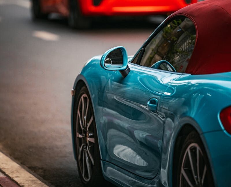 Luxury Cars - Vibrant blue sports car parked on a street in Ba #36703709
