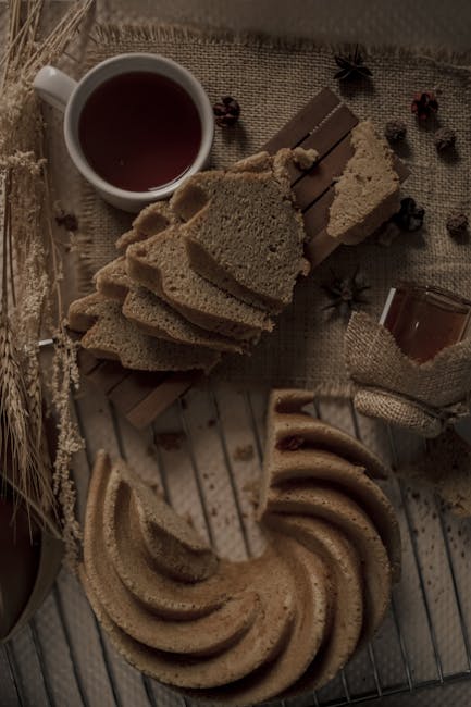 Food Aesthetics - A rustic flat-lay of sliced cake bread, tea, and #6638588