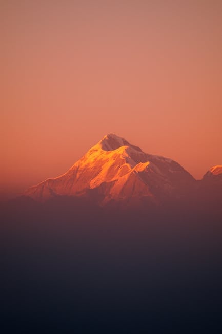 Mountain Landscapes - Snow-capped Himalayan peak glowing in the warm h #7719325