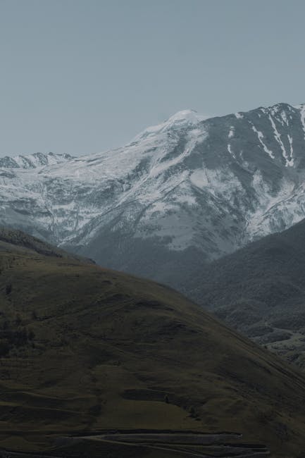 Mountain Landscapes - Majestic snow-covered mountains under a serene s #8750610